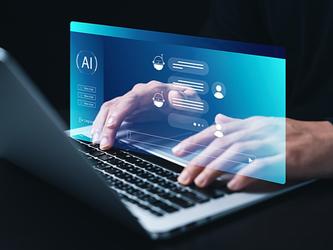 pair of hands typing at laptop overlaid with graphic of AI chatbot conversation 